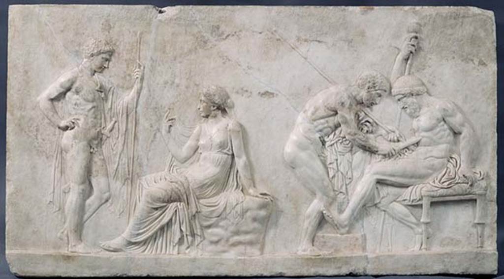 Ins. Orientalis I, 2, Herculaneum. Marble relief of Achilles and Telephus.
The relief depicts two key moments during Achilles’ journey to Troy: his consultation with the Delphic Oracle and his meeting with Telephus.
The relief, which preserves traces of polychrome paint, belonged to the decoration of a small antechamber of a triclinium, in the wall of which it was inserted.
Now in Naples Archaeological Museum. Inventory number 286787.